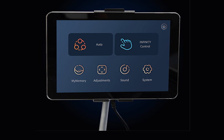 Infinity Imperial Syner-D 8-inch touchscreen tablet remote showing massage control interface