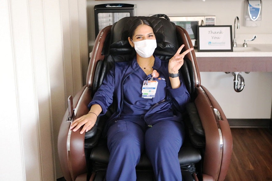 California Hospital Medical Center Nurse Enjoying The Massage Chair Donated by EasyMassageChair.com