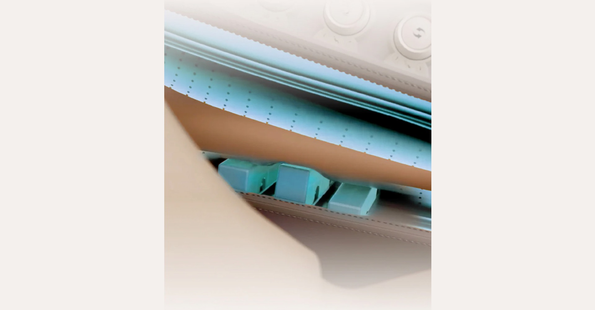 Osaki DuoMax piano key arm massage mechanism showing alternating key pattern inside armrest