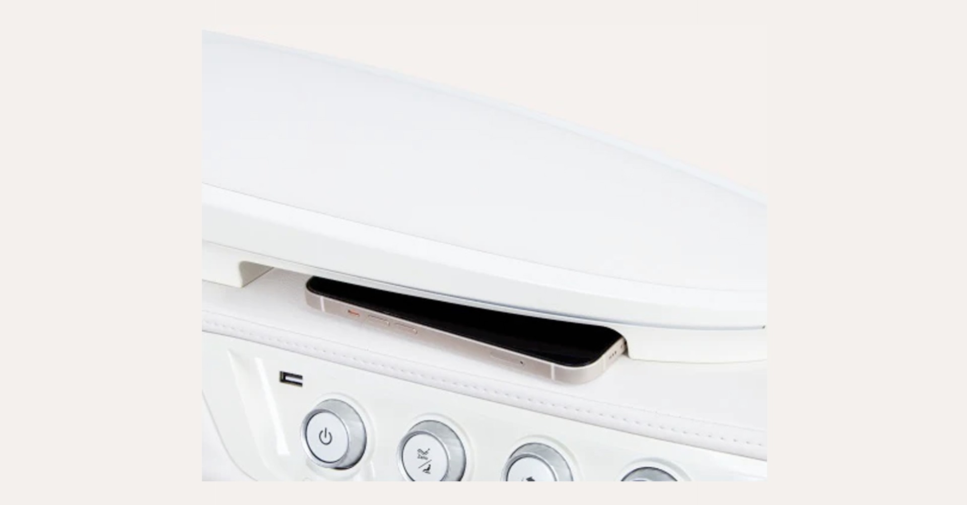 Osaki DuoMax wireless charging tray with phone and USB port on armrest